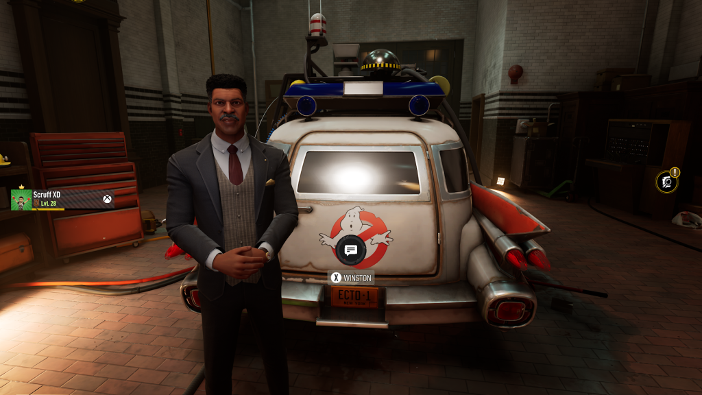 Winston Zeddemore standing beside the Ecto-1 inside the firehouse