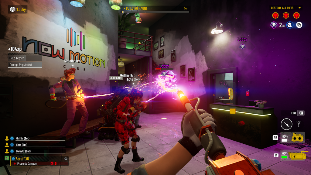 the team firing their particle throwers at a ghost in a nightclub