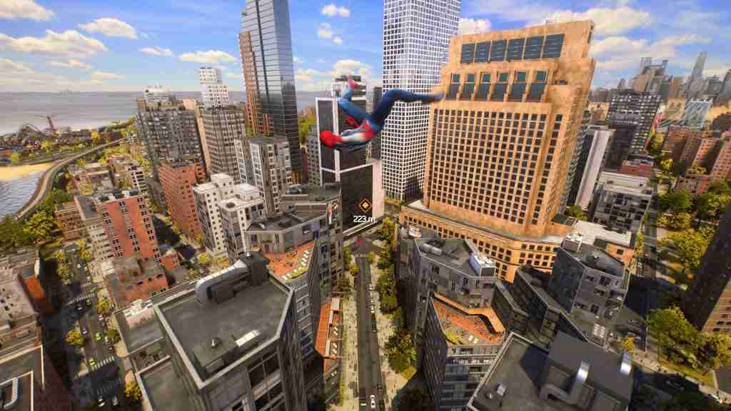 spider-man in blue and read does an acrobatic roll while swinging high above a city