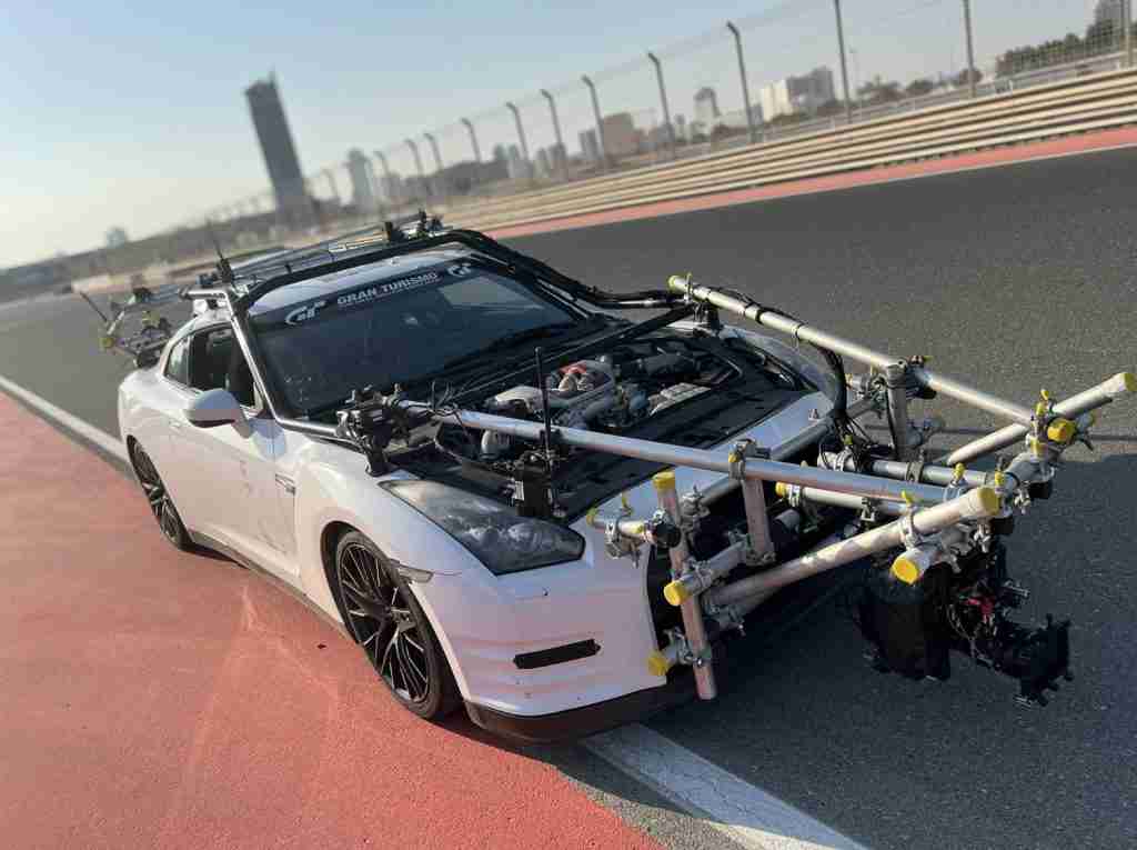 high end racing car with cameras mounted onto it