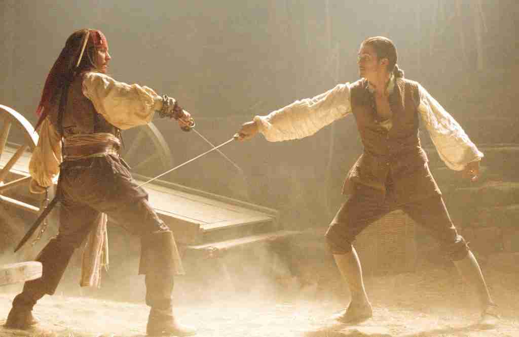 Jack Sparrow and Will Turner duel with swords