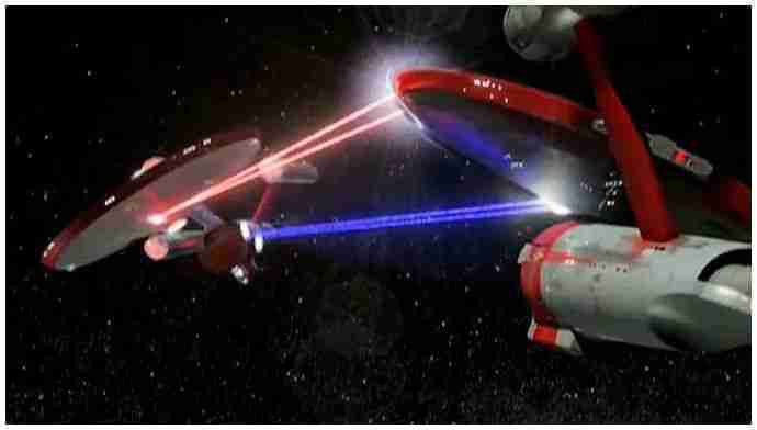 2 Constitution class Starships firing phasers at each other