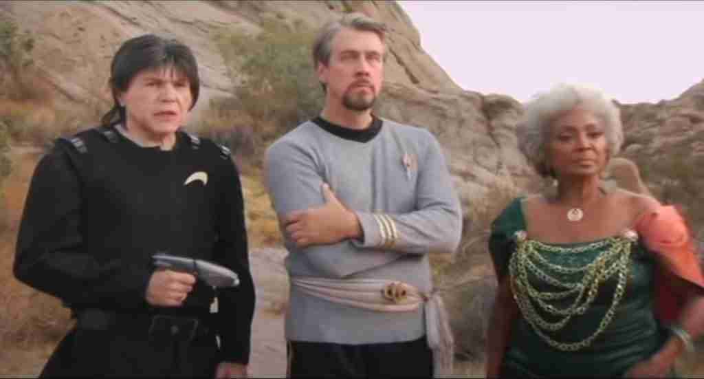 alternate versions of Chekhov, Harriman and Uhura standing in same place
