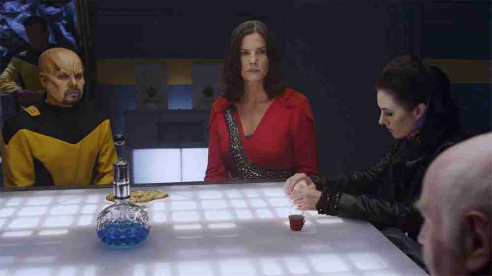 Fnaxnor (Aron Eisenberg) Jada, Lexxa and The Admiral plan around a table