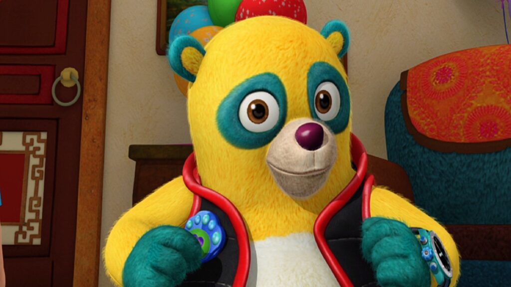 Oso - a yellow teddy bear with blue paws, eye rings and ear tips, wearing a black jacket