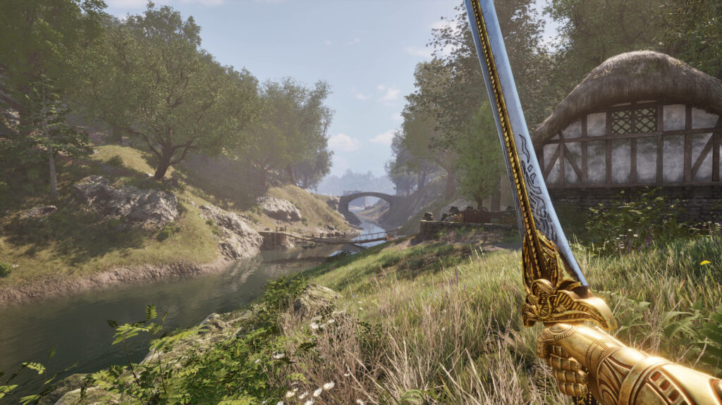 Oblivion - a gold armoured hand hold a gold adourned sword in first person next to a river