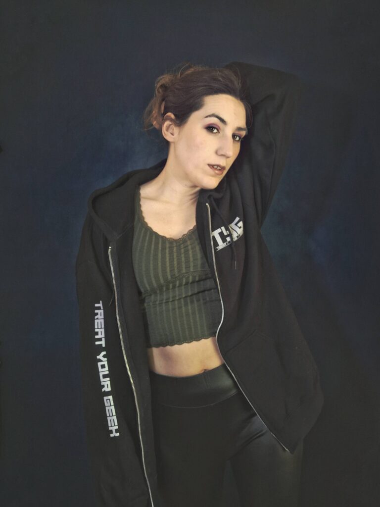 TYG Merch Mashashy wearing the TYG zip up hoodie in black