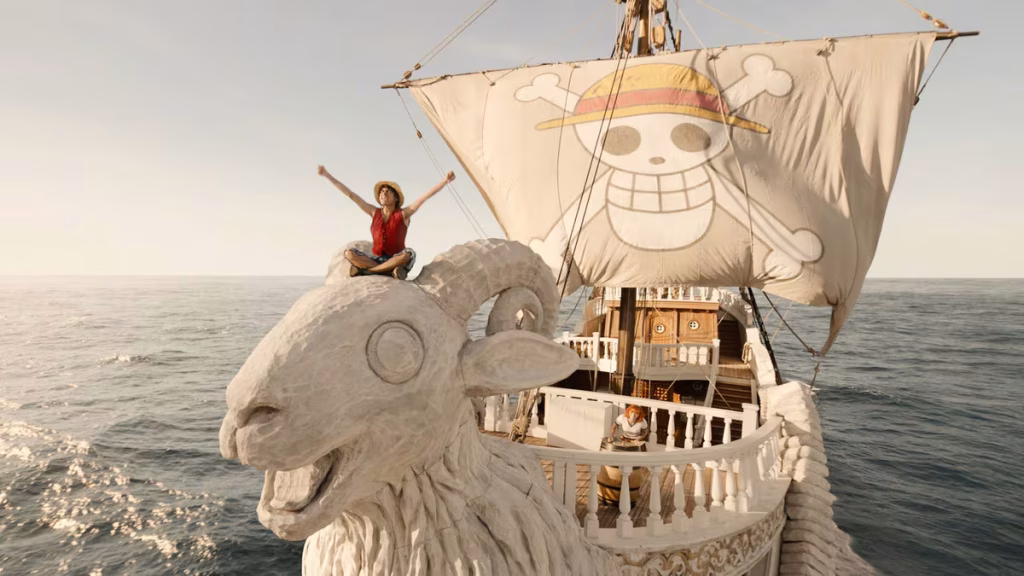 The one and only Going Merry!
Here we see Luffy sitting on the head of Merry, while we have Nami in the background. - One Piece Netflix
Nami is played by Emily Rudd