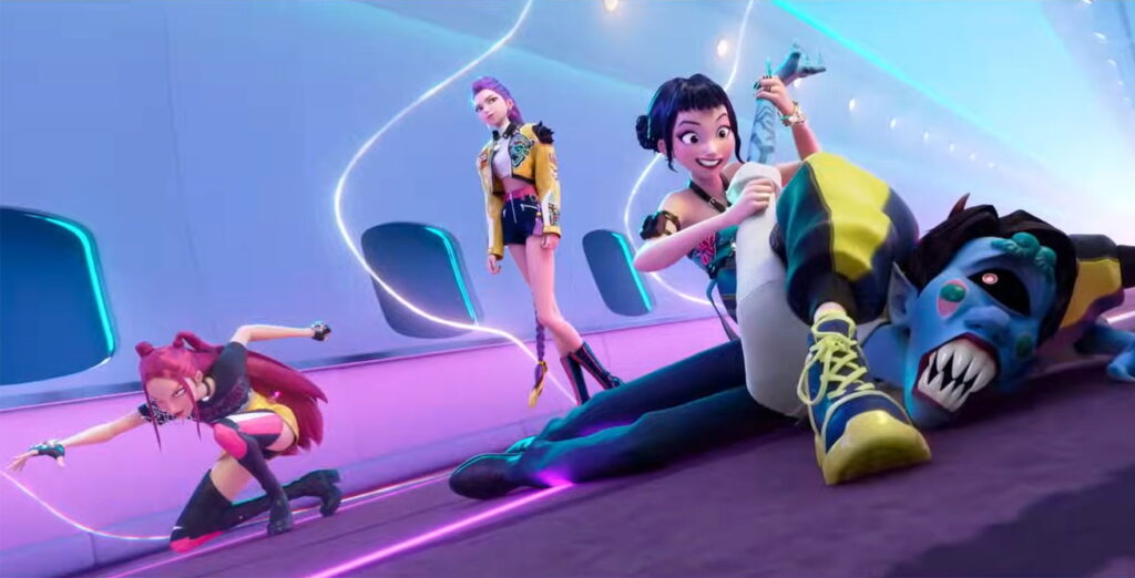 K-Pop Demon Hunters - The girls strike a pose as Zoey sits on a demon grinning
