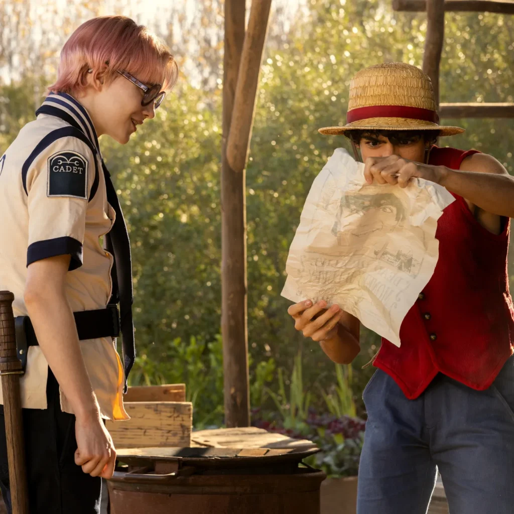 Koby (left) showing Luffy (right) his bounty. Koby is played by Morgan Davies
- One Piece Netflix
