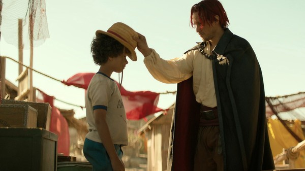 Shanks giving his straw hat to a young Luffy - One Piece Netflix