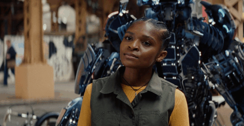 Ironheart- Riri in front of on open suit