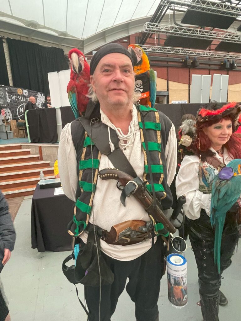 Pirates in attendance with a trio of real parrots - Comic Con 25