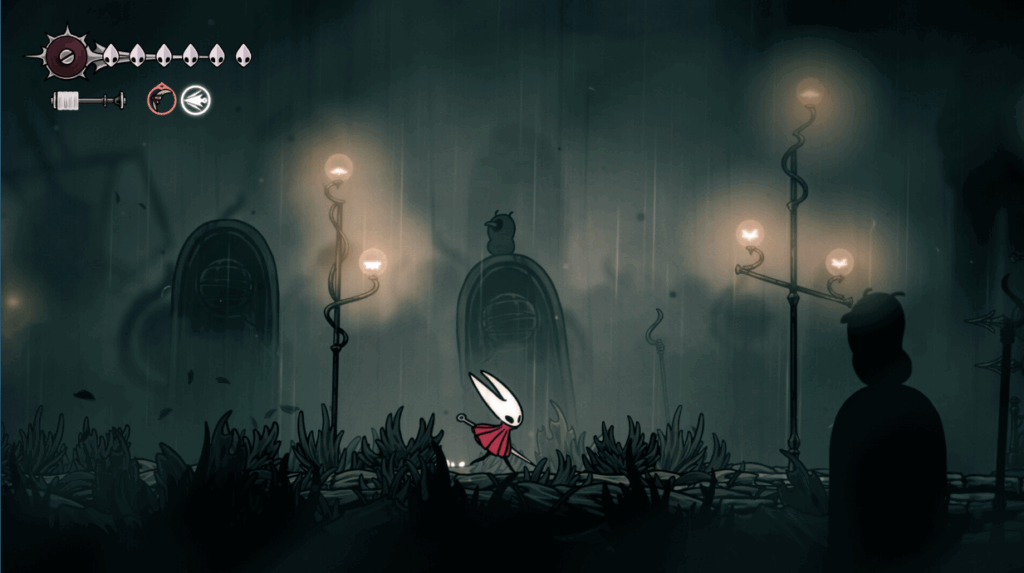Image of silksong the game with hornet walking through a graveyard. - Silksong