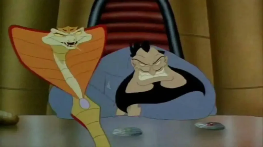 Villain El Supremo and Messina (Snake form) scowl off screen -  Freddie as F.R.O.7 