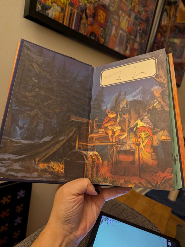 A photograph of the inner cover of Brigands & Breadknives by Travis Baldree. It's an illustrated image of a cheerful, red-headed goblin, a small ratkin, a horse, and a blonde, one-eared elf.