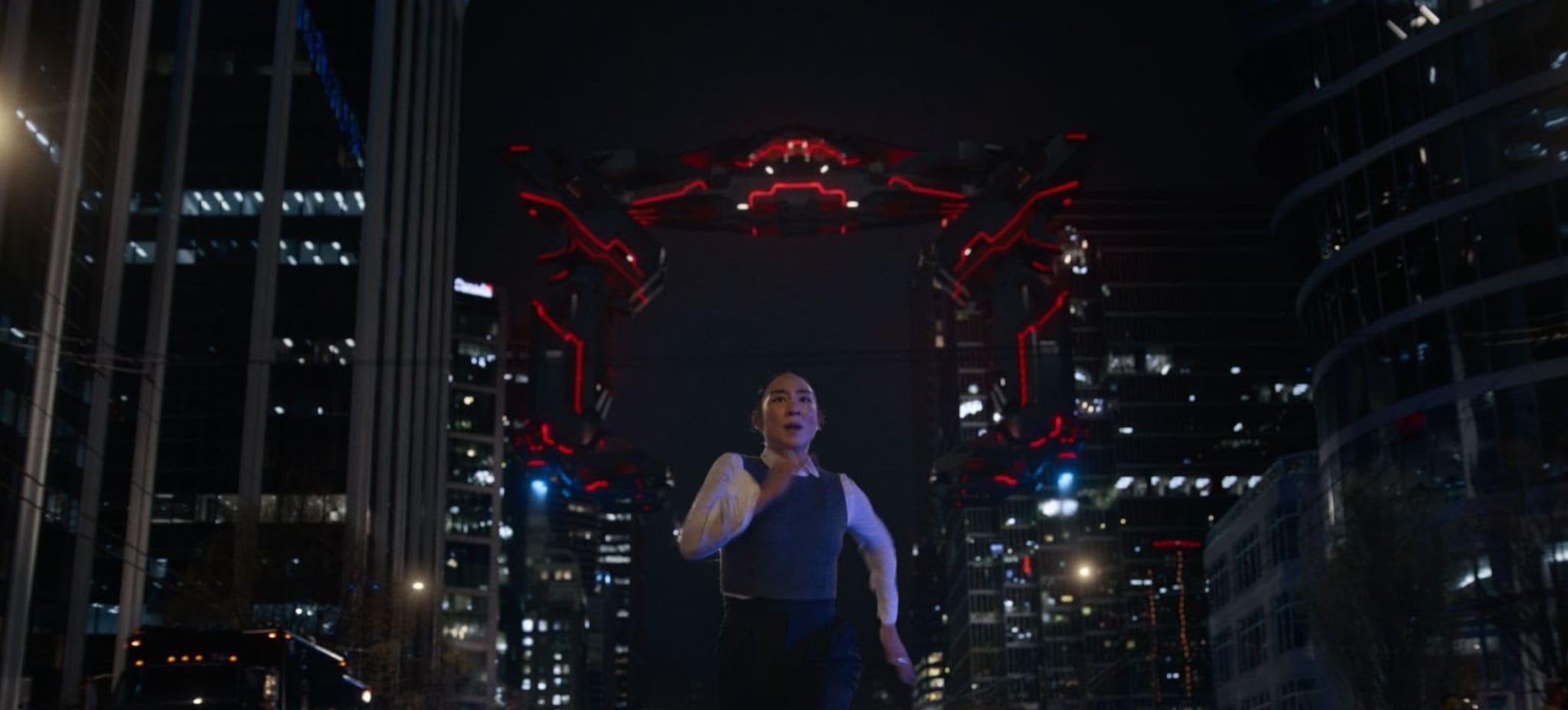 Tron: Ares. Eve running away from a Recognizer, a red and black flying robot