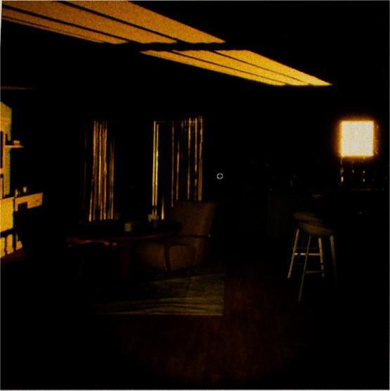 UFOPHILIA - A dark room in a house. A bright yellow light streaming in through the blinds in windows to the back left and the top of the door to the back right. Some chairs, and a table can be seen to the left. Some stools seen to the right.