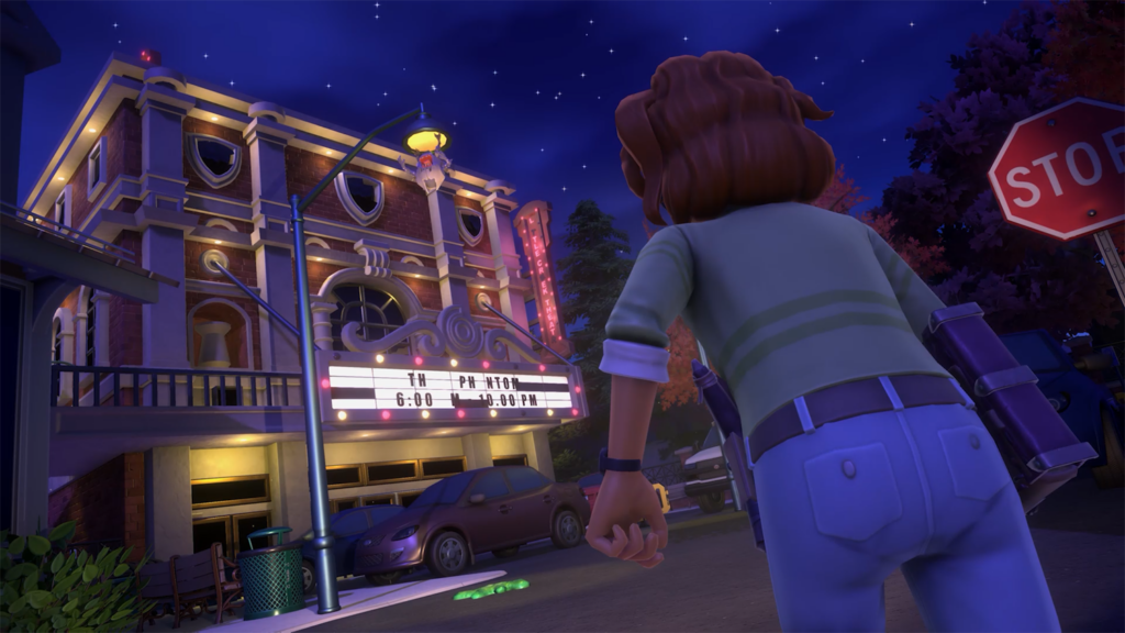 Goosebumps: Terror in Little Creek: Sloan stands in front of the theatre with a monster hanging from the light