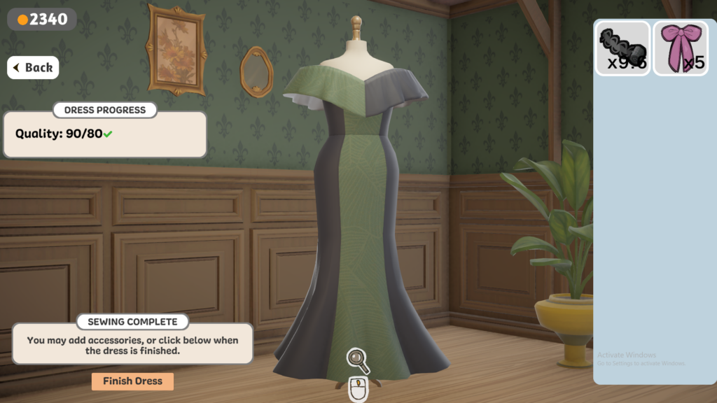 Dressmaker - Black and green dress complete on mannequin