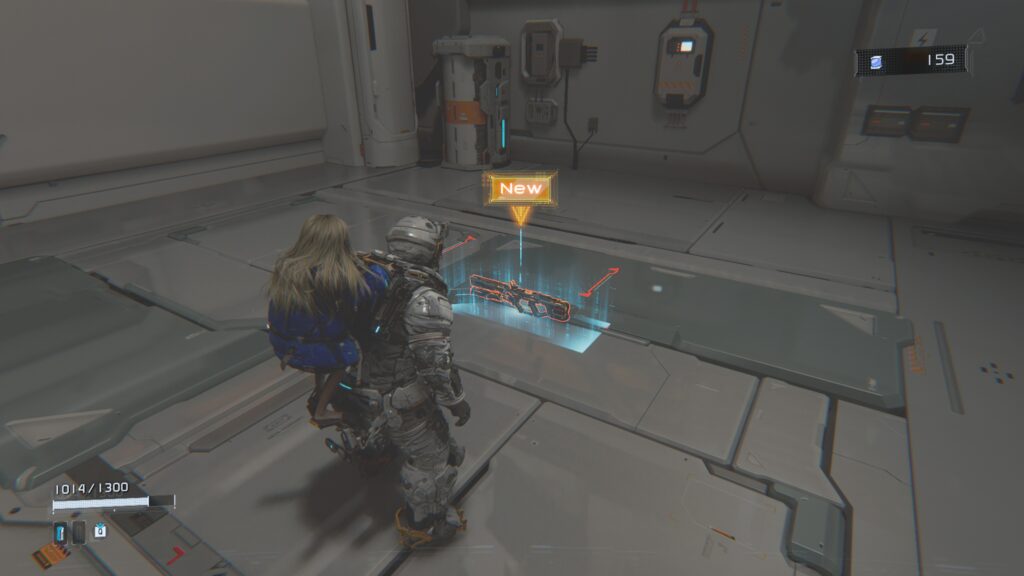 Hugh with Diana on his back looking down at a highlighted rifle on the floor. A large arrow with "New" hovering above it.
Pragmata