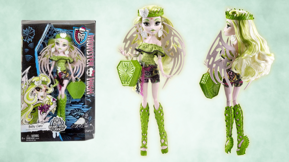 Batsy claro monster high doll, in and out of her box. She has light skin with green hair and clothes. She also has bat wings.