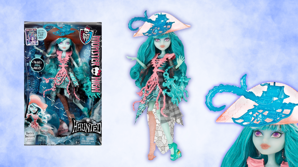 Vandala doubloons monmster high doll is shown both inside and out of her box. She is a ghost pirate with a peg leg and large pirate hat.