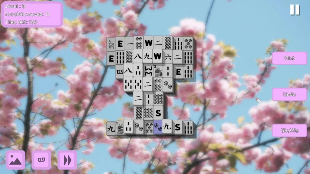 Image shows level eight with cherry blossom background and grey and black mahjong tiles