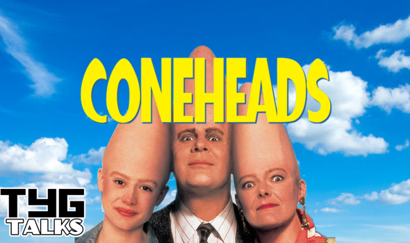 A bright blue sky with fluffy white clouds in the background, three people at the bottom centre facing forward with coneheads. The title "Coneheads" in the middle centre and the TYG Talks logo in the bottom left