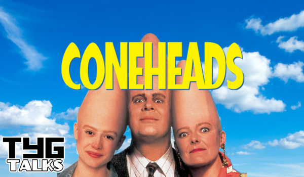 A bright blue sky with fluffy white clouds in the background, three people at the bottom centre facing forward with coneheads. The title "Coneheads" in the middle centre and the TYG Talks logo in the bottom left