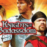 A fiery orange and yellow background behind four people dressed in medieval clothing. A firelighter in the hand of the left most person, all people looking away in different directions. The title of the Film "knights of Badassdom" at it's centre left.