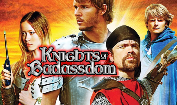 A fiery orange and yellow background behind four people dressed in medieval clothing. A firelighter in the hand of the left most person, all people looking away in different directions. The title of the Film "knights of Badassdom" at it's centre left.