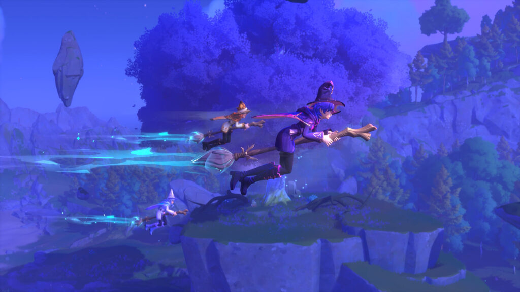 Witchspire - three witches fly on brooms through a purple hued landscape