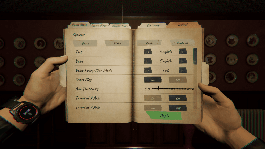 Phasmophobia - The player is holding the journal with the game settings menu open. Behind the journal is a pink wallpaper with rows of plates with animal photos on them mounted on the wall.