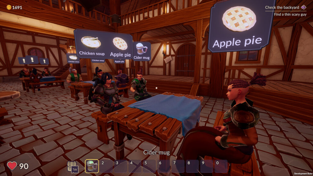 Ale & Tale Tavern - fantasy themed customers sitting at a table waiting for food