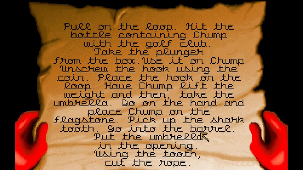 Gobliiins Collection - A screenshot of gameplay from Goblins 3. Two hands hold a map with long instructions of how to solve the puzzles.