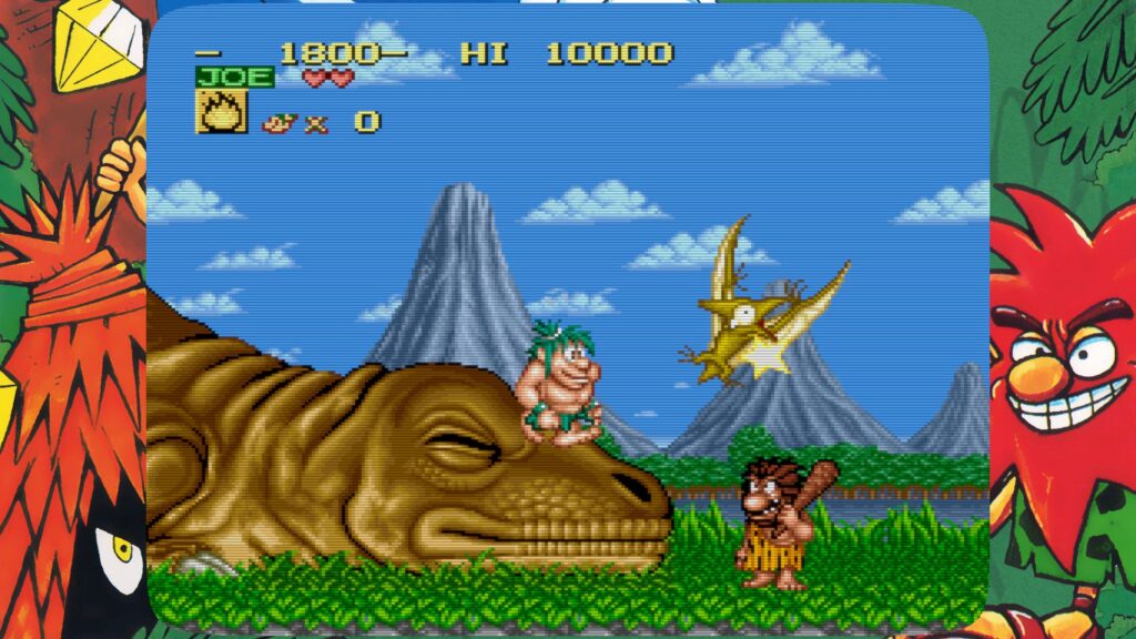  Joe & Mac Retro Collection as Joe stands on the nose of a dinosaur